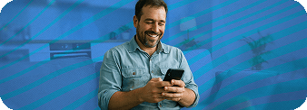 Man smiling at his phone