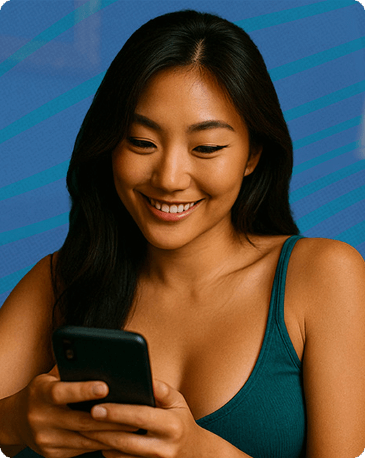 Woman smiling while holding her phone