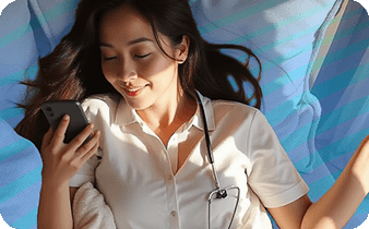 A female asian doctor lying in bed, looking at her phone