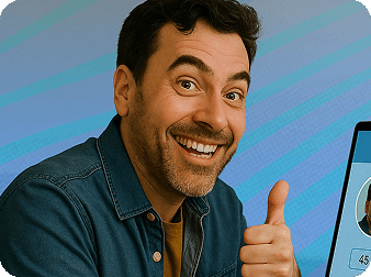Close-up of a man smiling and giving a thumbs up, his laptop with his dating profile open, but out of frame